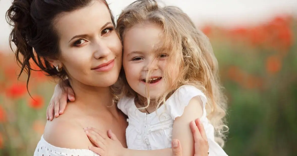 Perfect-Mother-–-a-mother-and-daughter-together-in-an-open-field-outdoors-capturing-a-peaceful-moment-of-connection-freedom-and-natural-motherhood