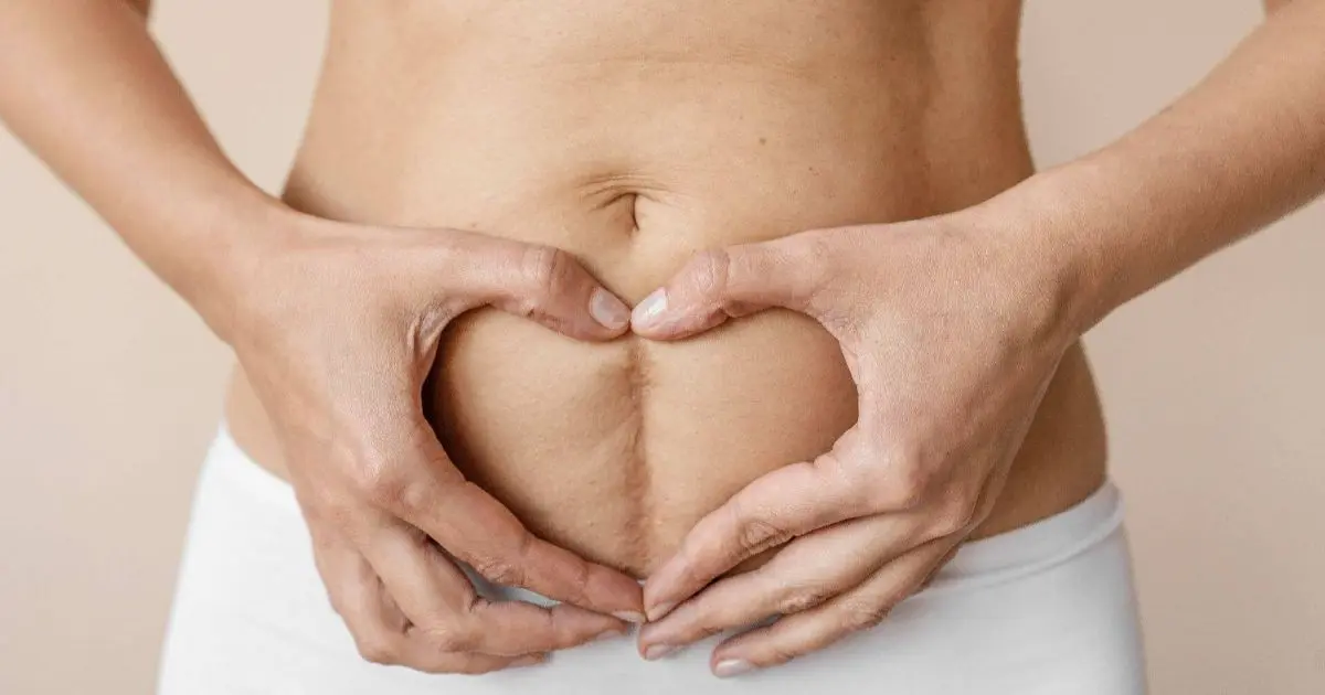 Postpartum Changes: A New Chapter for Your Body Heart shape made with hands representing support through postpartum changes.
