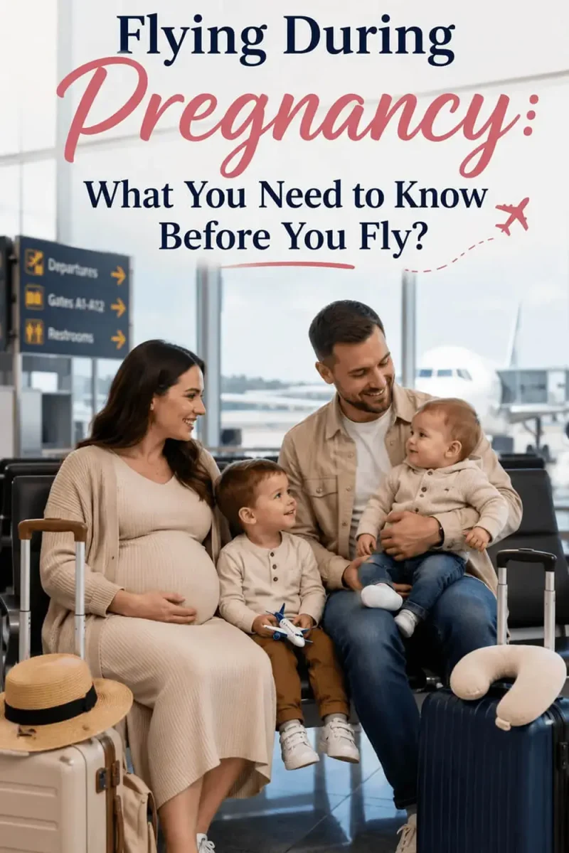 Flying During Pregnancy – Pregnant woman sitting with her husband and two young children in an airport terminal beside their suitcases while waiting to board a flight.