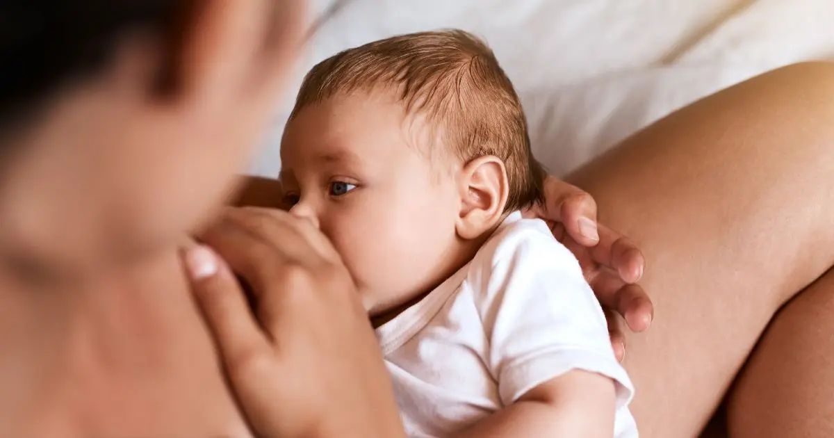 Breastfeeding close-up of baby feeding from mother, showing bonding and natural nutrition