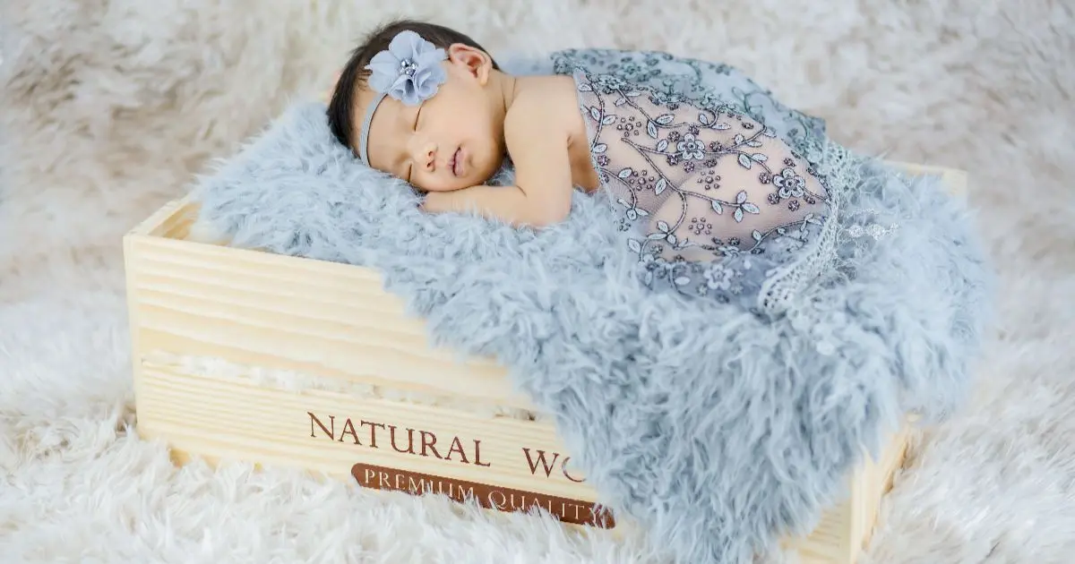 Mother’s Day newborn baby sleeping peacefully in a soft blanket, perfect keepsake memory moment
