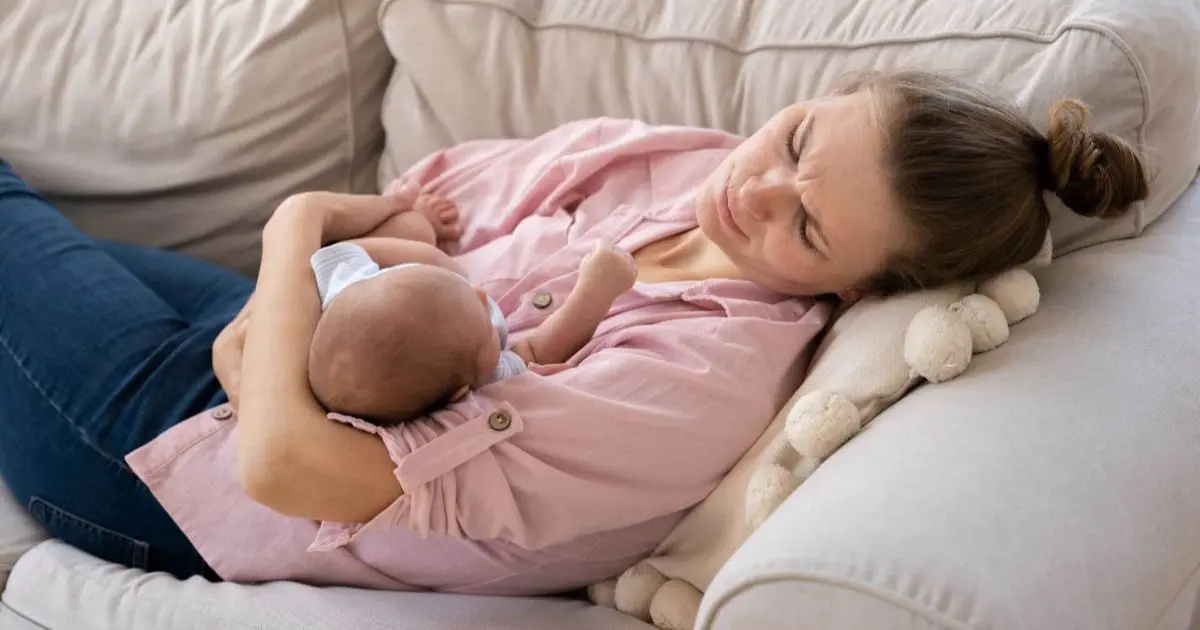 sleep deprivation mother resting with baby during the postnatal period