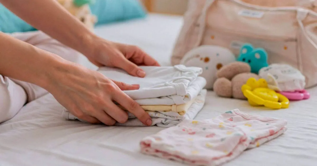 Preparing baby essentials neatly arranged for a newborn, symbolizing readiness and care before the baby’s arrival.