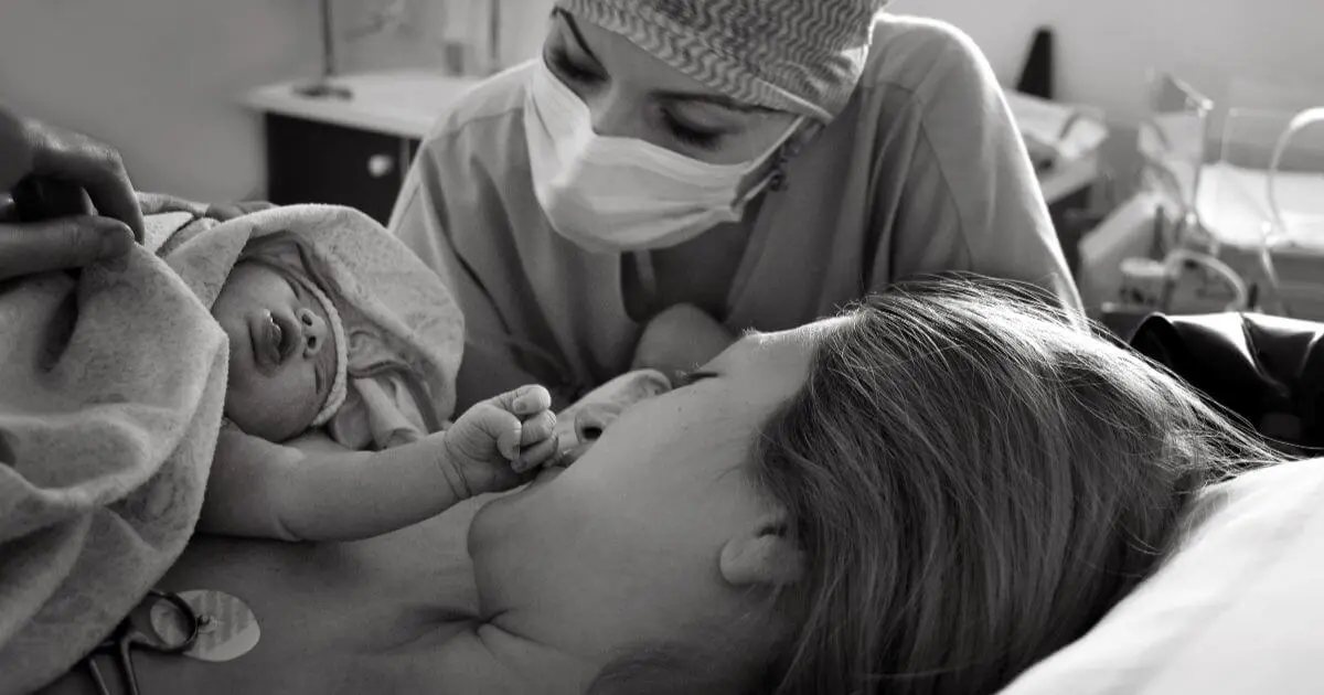 The Stages of Labor: What Really Happens During Labor and Birth? Stages of Labor infographic showing the immediate postpartum golden hour, with a newborn placed skin-to-skin on the mother's chest shortly after birth in a hospital delivery room.
