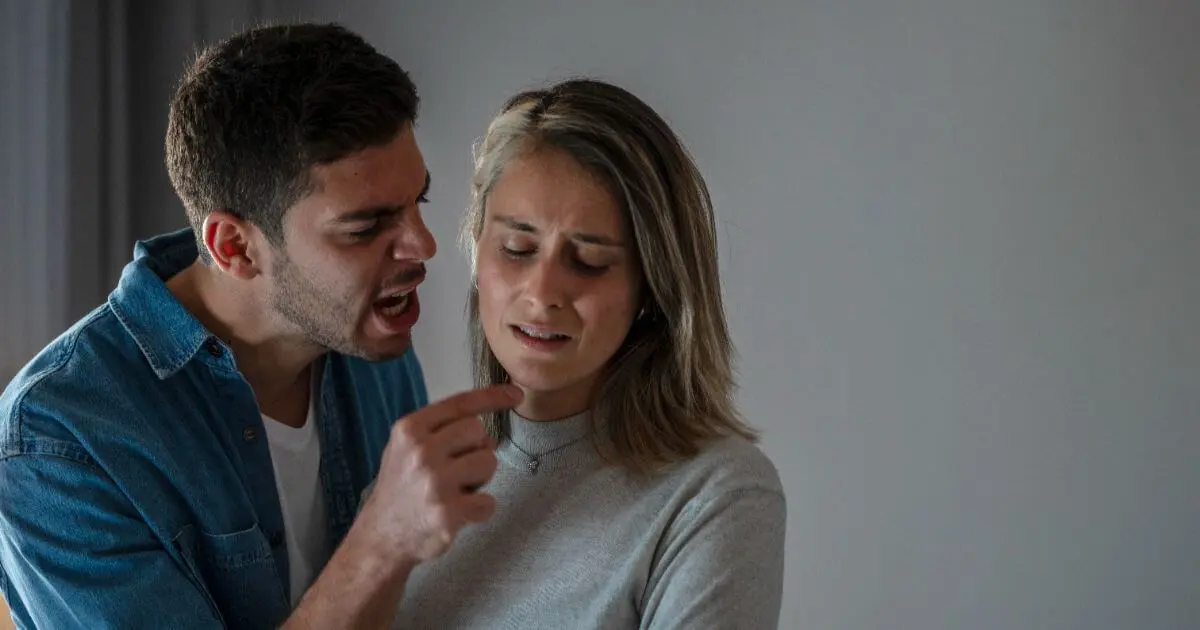 man shouting during argument while woman looks overwhelmed, intense conflict in relationship after baby